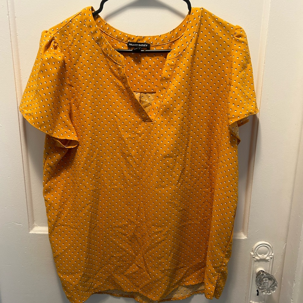 Yellow and white polka dot blouse